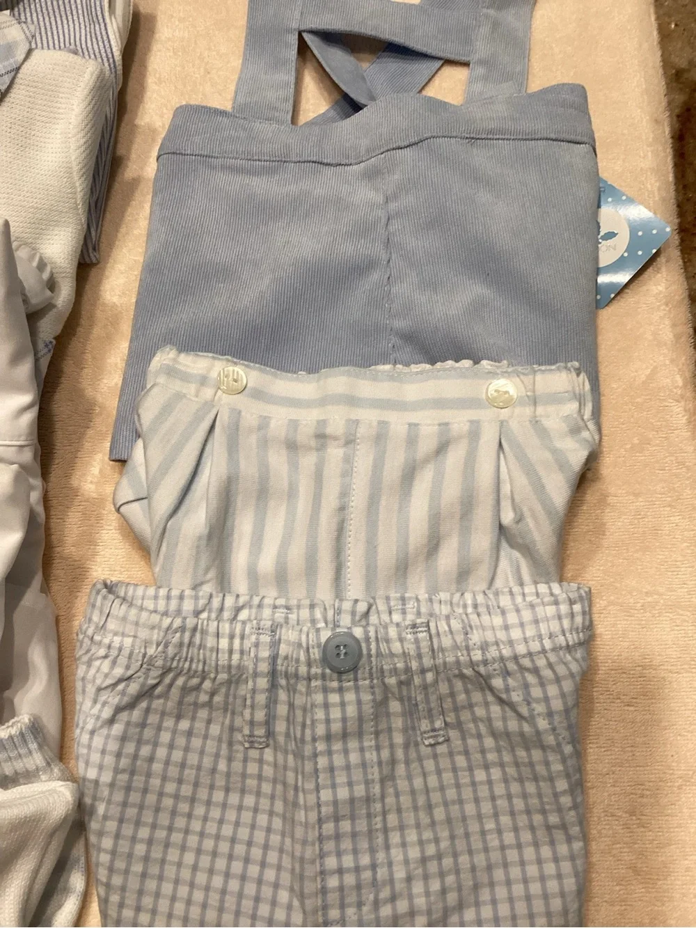 Baby outfits in blue and white. 5 outfits and 3 pairs of shorts